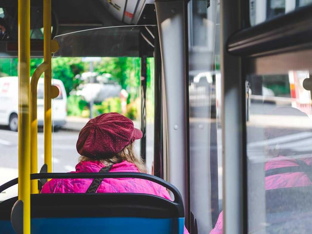 woman sitting inside bus