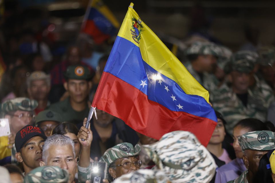 Venezuelan flag held in air
